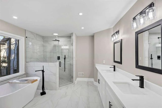 3017 Lana Ln, Marietta, GA 30066 - full bathroom featuring marble finish flooring, recessed lighting, a stall shower, a freestanding tub, and double vanity