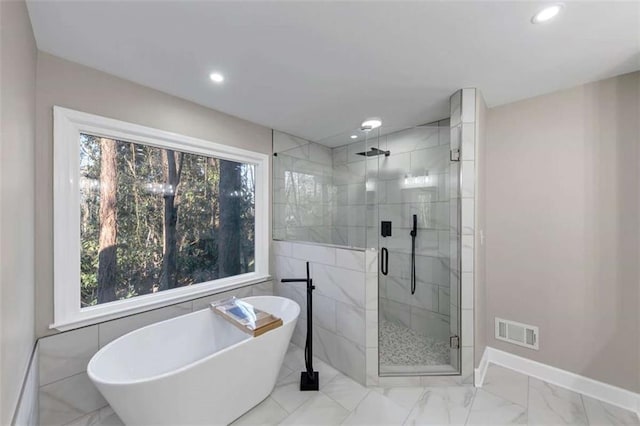 3017 Lana Ln, Marietta, GA 30066 - bathroom with a soaking tub, marble look tiles, baseboards, recessed lighting, and a stall shower