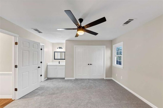 3017 Lana Ln, Marietta, GA 30066 - unfurnished bedroom featuring baseboards, light carpet, a closet, and a ceiling fan