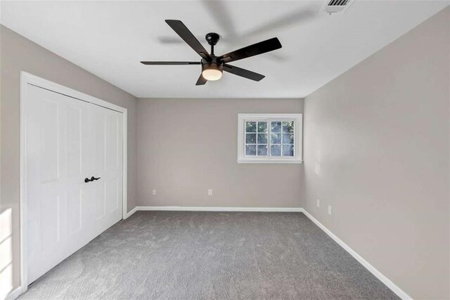 3017 Lana Ln, Marietta, GA 30066 - unfurnished bedroom featuring carpet, baseboards, a closet, and ceiling fan