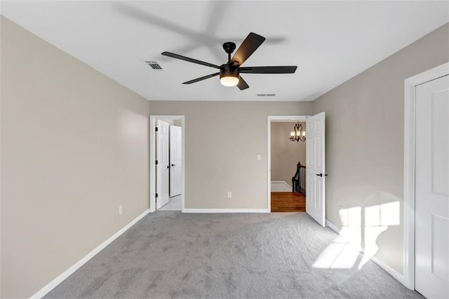 3017 Lana Ln, Marietta, GA 30066 - unfurnished bedroom with carpet floors, baseboards, a chandelier, and a ceiling fan