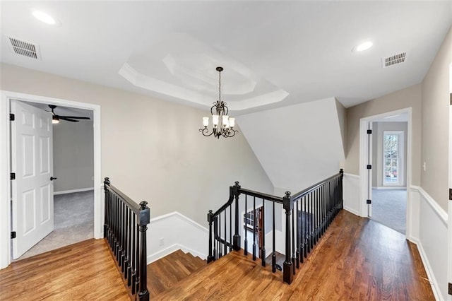 3017 Lana Ln, Marietta, GA 30066 - stairs featuring wood finished floors, a chandelier, recessed lighting, baseboards, and a raised ceiling