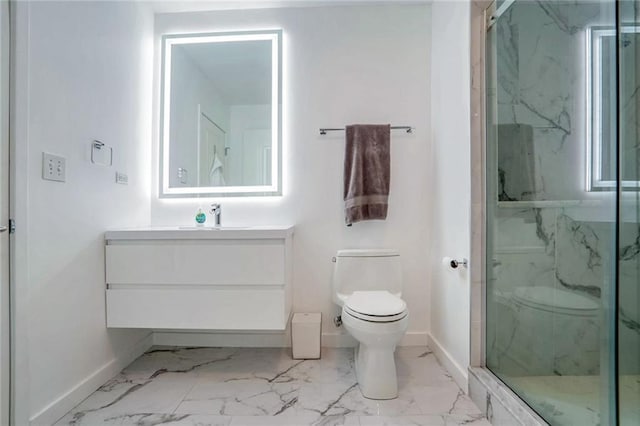 full bath featuring toilet, marble look tile flooring, a marble finish shower, and baseboards