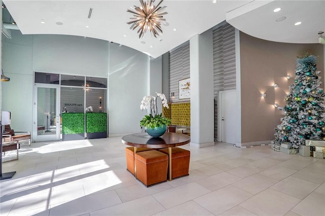 lobby featuring a high ceiling and recessed lighting
