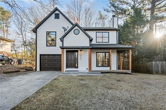 view of front of property with a garage and a porch