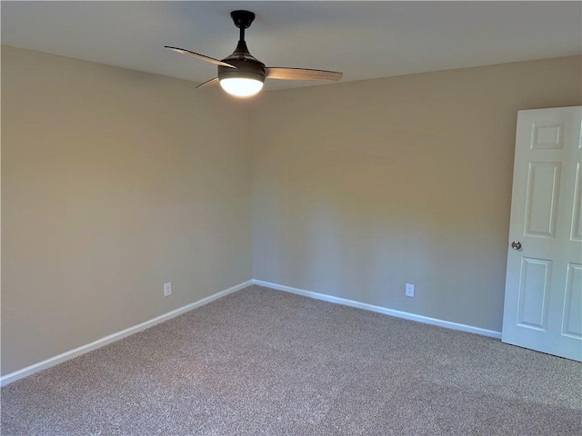 spare room with ceiling fan and carpet floors