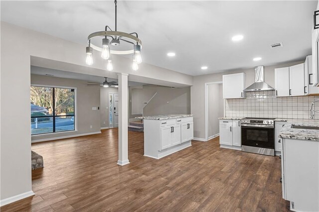 spare room with ceiling fan and light colored carpet