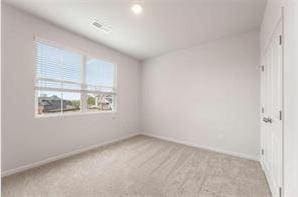 unfurnished room with light colored carpet