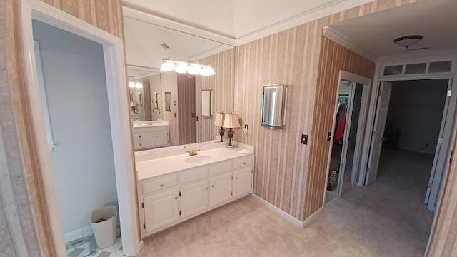 bathroom with vanity and ornamental molding