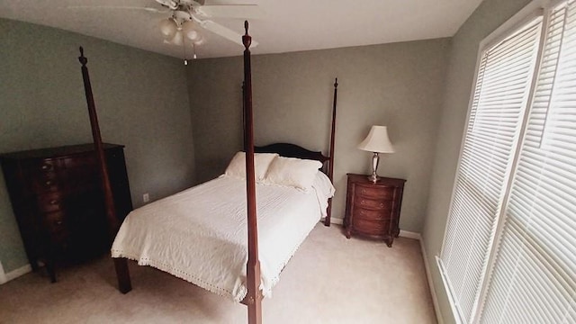 bedroom featuring ceiling fan and light colored carpet