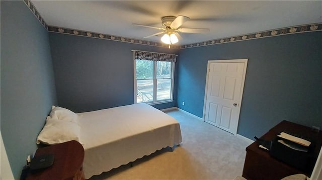 bedroom featuring ceiling fan and light colored carpet