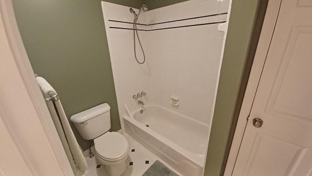 bathroom featuring shower / tub combination, tile patterned floors, and toilet