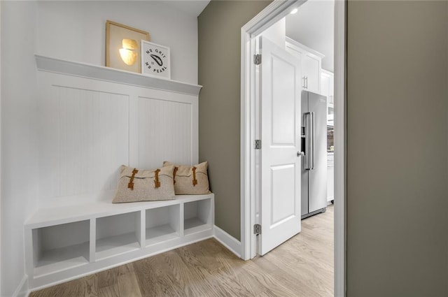 mudroom with light hardwood / wood-style flooring