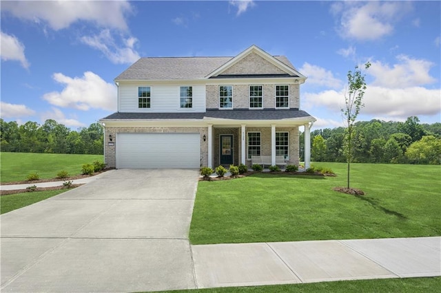 view of front of property featuring a garage, a front lawn, and a porch