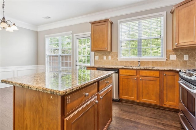 2252 Limehurst Dr NE, Atlanta, GA 30319 - kitchen with a sink, appliances with stainless steel finishes, a chandelier, light stone countertops, and plenty of natural light