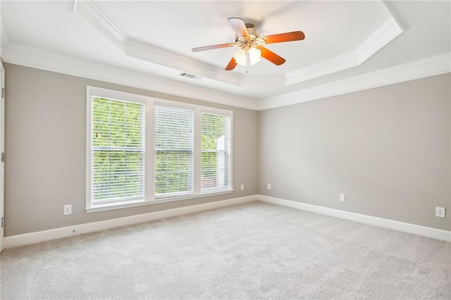 2252 Limehurst Dr NE, Atlanta, GA 30319 - spare room with crown molding, a raised ceiling, a ceiling fan, light carpet, and baseboards