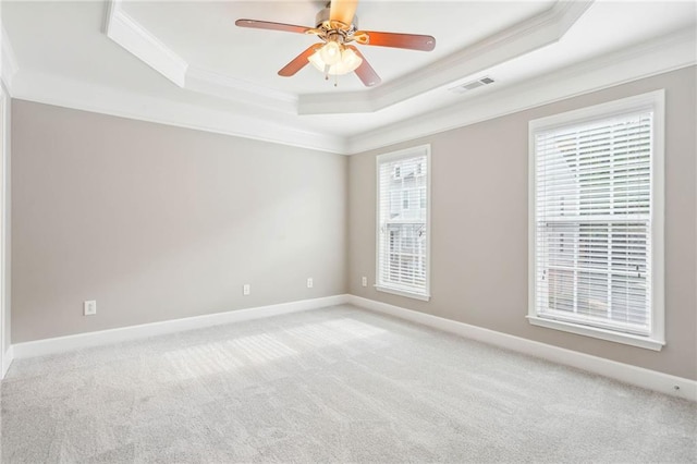 2252 Limehurst Dr NE, Atlanta, GA 30319 - empty room featuring ornamental molding, a raised ceiling, light carpet, a ceiling fan, and baseboards