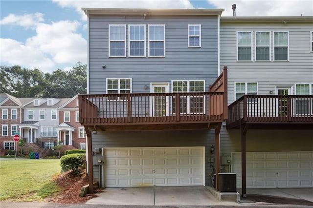 2252 Limehurst Dr NE, Atlanta, GA 30319 - rear view of property with a garage, central AC unit, a balcony, driveway, and a yard