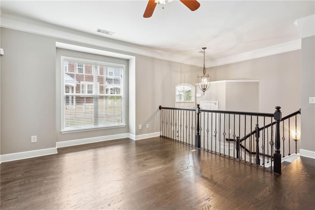 2252 Limehurst Dr NE, Atlanta, GA 30319 - spare room with a ceiling fan, crown molding, wood finished floors, a chandelier, and baseboards