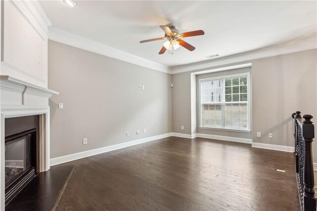 2252 Limehurst Dr NE, Atlanta, GA 30319 - unfurnished living room with ceiling fan, dark wood-style floors, crown molding, a glass covered fireplace, and baseboards