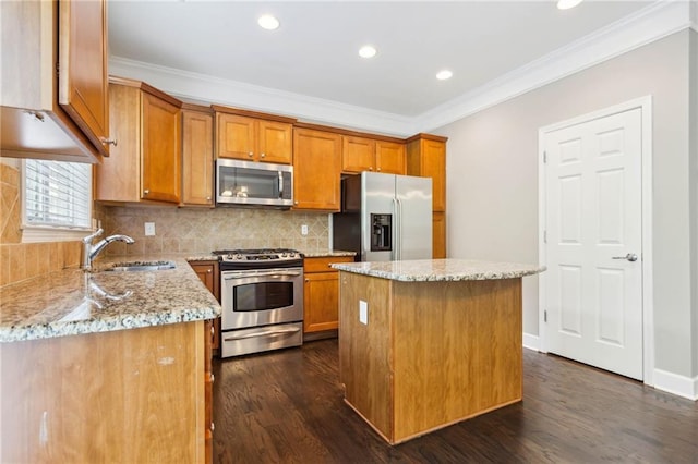 2252 Limehurst Dr NE, Atlanta, GA 30319 - kitchen featuring appliances with stainless steel finishes, a sink, brown cabinets, light stone counters, and dark wood-style floors