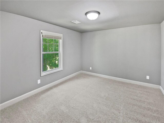 60 Hammock Dr, Covington, GA 30016 - spare room with light carpet and baseboards