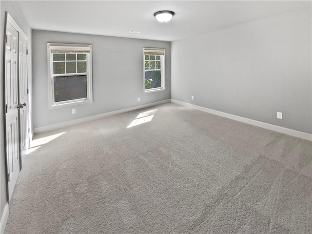 60 Hammock Dr, Covington, GA 30016 - unfurnished bedroom featuring baseboards and carpet flooring