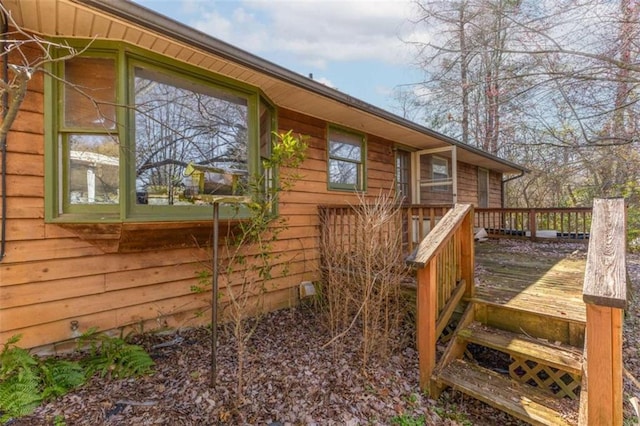 view of home's exterior featuring a wooden deck