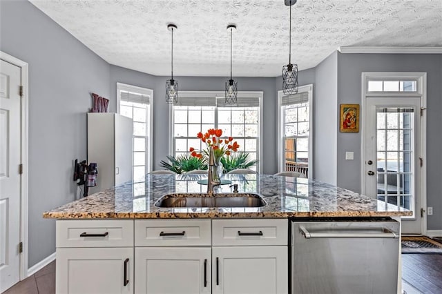 kitchen featuring a sink, a center island with sink, white cabinets, and dishwasher