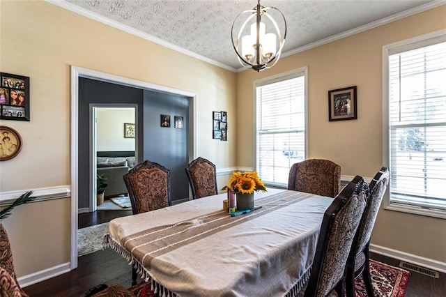 dining area with dark wood-style flooring, visible vents, and a healthy amount of sunlight