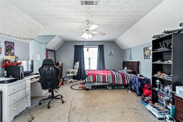 carpeted bedroom with lofted ceiling, visible vents, ceiling fan, and a textured ceiling