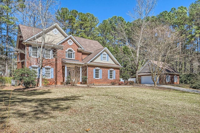 100 Hamilton Glen Ct, Fayetteville, GA 30215 - georgian-style home featuring brick siding, a front lawn, a detached garage, and an outdoor structure