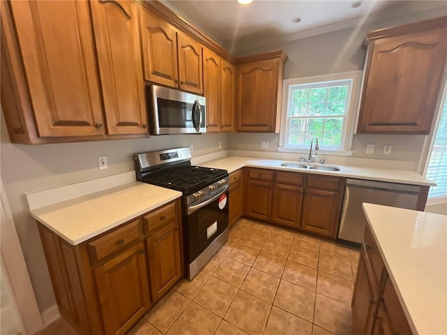 100 Hamilton Glen Ct, Fayetteville, GA 30215 - kitchen featuring appliances with stainless steel finishes, light countertops, light tile patterned floors, brown cabinets, and recessed lighting