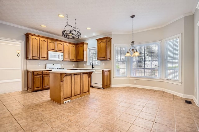 100 Hamilton Glen Ct, Fayetteville, GA 30215 - kitchen with white appliances, a chandelier, brown cabinets, light countertops, and a breakfast bar