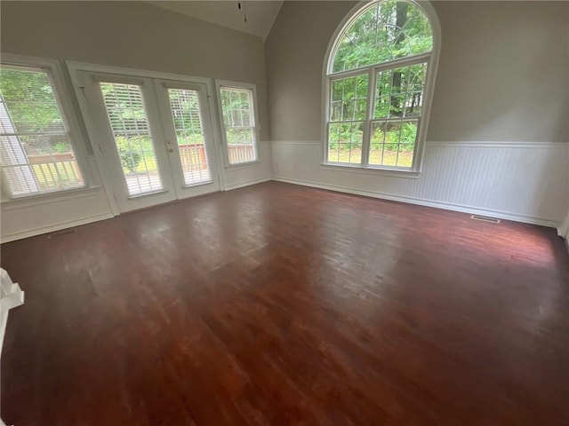 100 Hamilton Glen Ct, Fayetteville, GA 30215 - unfurnished room with vaulted ceiling, a wainscoted wall, wood finished floors, and french doors