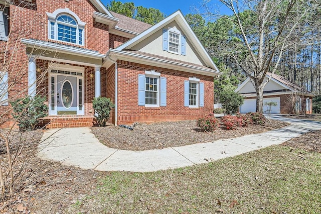 100 Hamilton Glen Ct, Fayetteville, GA 30215 - traditional-style house with brick siding, stucco siding, a garage, and an outbuilding