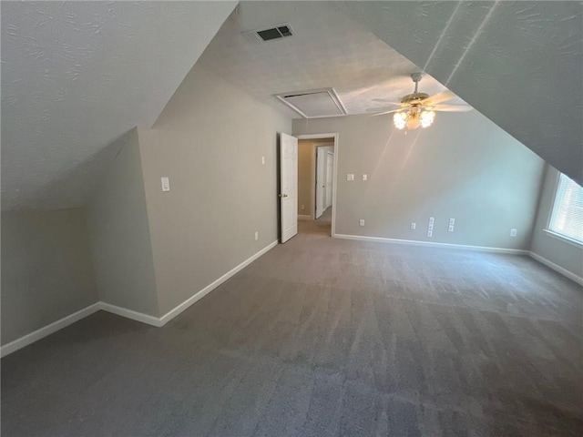 100 Hamilton Glen Ct, Fayetteville, GA 30215 - additional living space featuring a textured ceiling, lofted ceiling, carpet flooring, a ceiling fan, and attic access