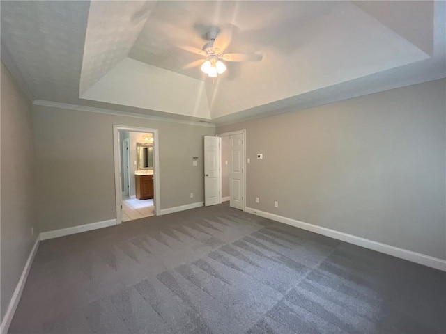 100 Hamilton Glen Ct, Fayetteville, GA 30215 - unfurnished bedroom with a tray ceiling, carpet flooring, ceiling fan, and ensuite bath