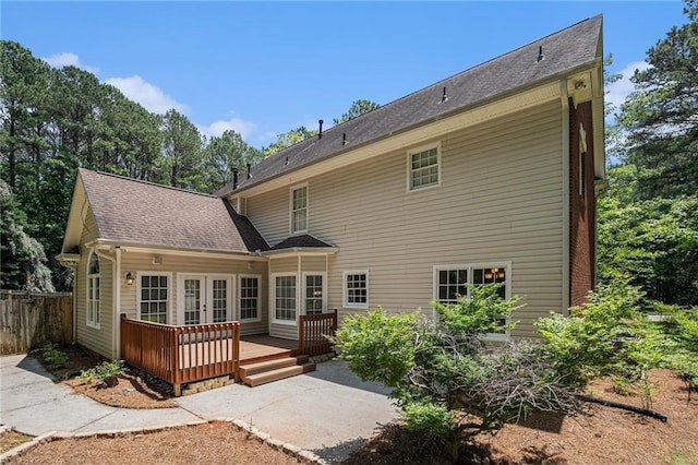 100 Hamilton Glen Ct, Fayetteville, GA 30215 - back of property featuring french doors, a wooden deck, and a shingled roof
