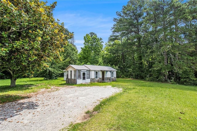1186 Eastview Rd NE, Conyers, GA 30012 - manufactured / mobile home with a front lawn and a forest view