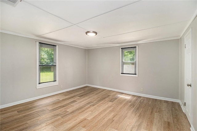 1186 Eastview Rd NE, Conyers, GA 30012 - spare room featuring light wood-type flooring and ornamental molding