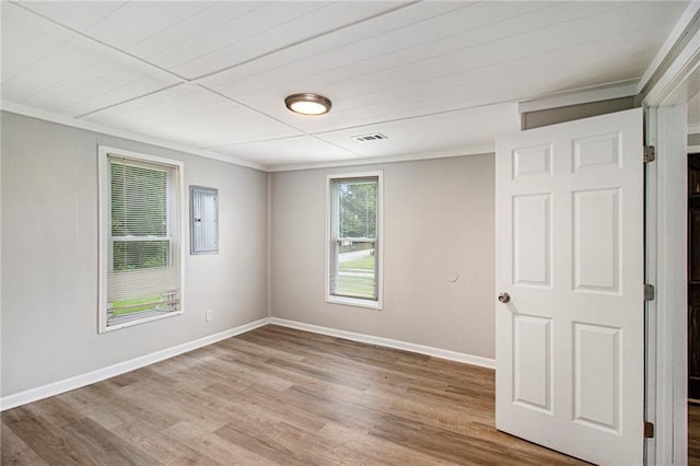 1186 Eastview Rd NE, Conyers, GA 30012 - unfurnished room with crown molding and light wood-style flooring