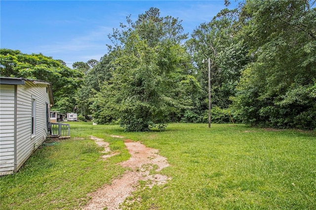 1186 Eastview Rd NE, Conyers, GA 30012 - view of green lawn with a forest view