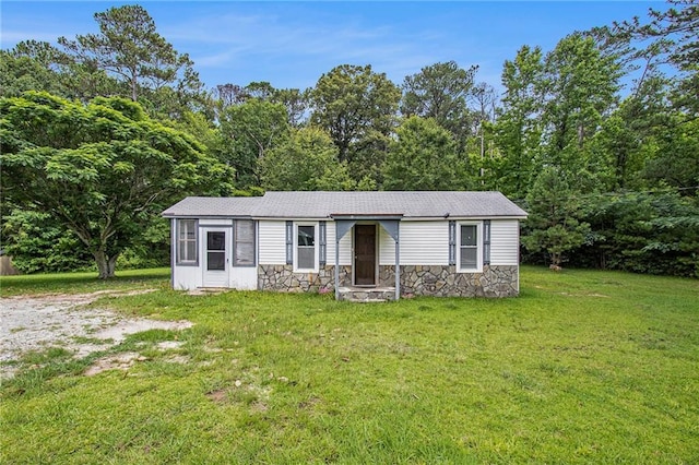 1186 Eastview Rd NE, Conyers, GA 30012 - view of front of home featuring stone siding and a front lawn