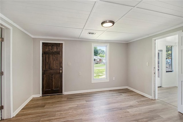 1186 Eastview Rd NE, Conyers, GA 30012 - empty room featuring light wood-type flooring and crown molding