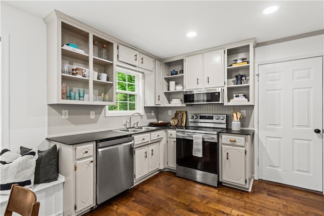 1320 Country Acres Ln, Lawrenceville, GA 30045 - kitchen featuring appliances with stainless steel finishes, open shelves, dark countertops, dark wood-style flooring, and tasteful backsplash