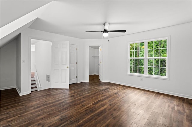 1320 Country Acres Ln, Lawrenceville, GA 30045 - unfurnished bedroom with dark wood-style floors, a spacious closet, ceiling fan, and a closet