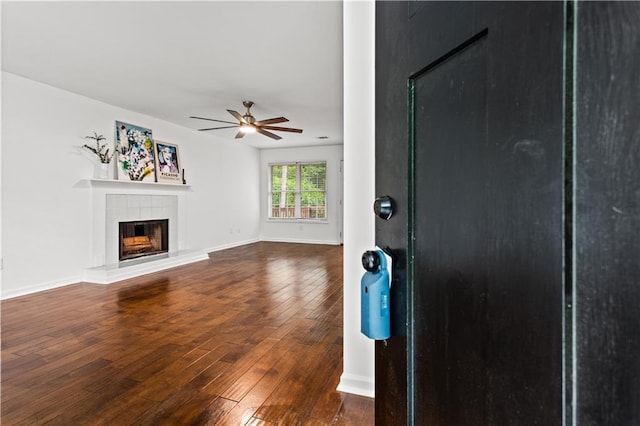 1320 Country Acres Ln, Lawrenceville, GA 30045 - unfurnished living room with a ceiling fan, hardwood / wood-style floors, and a tile fireplace