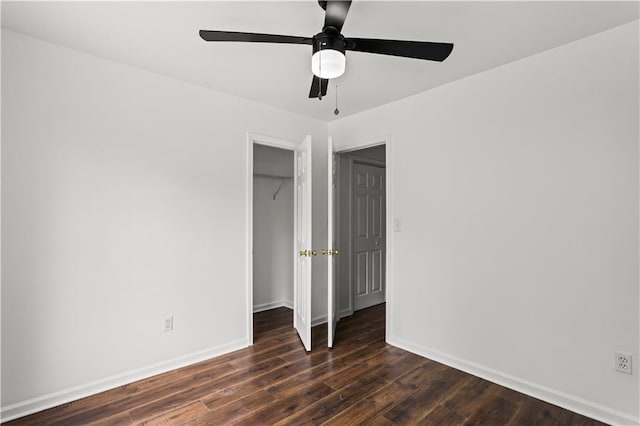 1320 Country Acres Ln, Lawrenceville, GA 30045 - unfurnished bedroom featuring a closet, dark wood-type flooring, and a ceiling fan