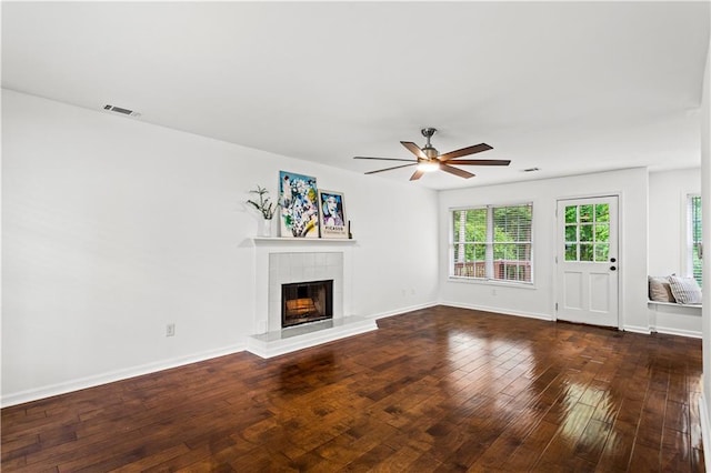 1320 Country Acres Ln, Lawrenceville, GA 30045 - unfurnished living room with ceiling fan, a tiled fireplace, and dark wood finished floors